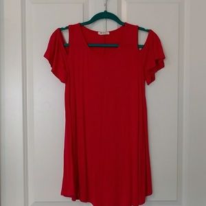 Dark pink tunic with open shoulders.